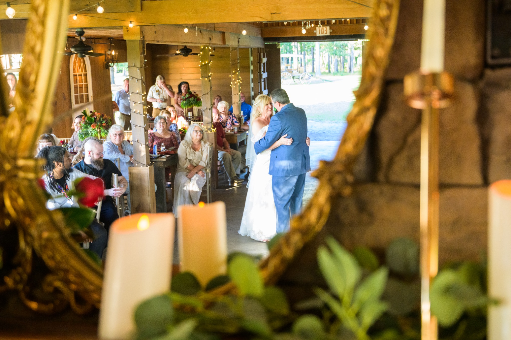 Newlyweds dancing inside the reception barn at Wildhorse at Parker Farms
